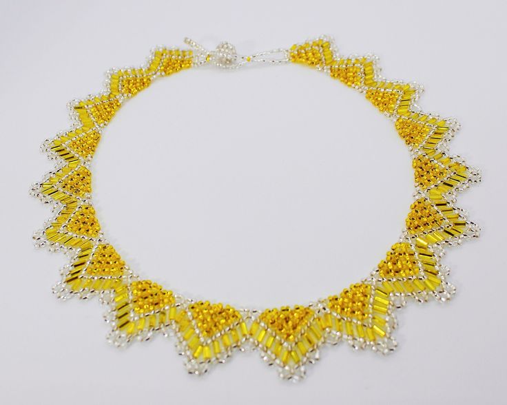 The dimensions of the Necklace: * Length: around the inside of the collar (end to end) is approx. 19.8 inches (50.2 cm) * Height: 1.2 inches (3cm) * Approximate weight: 29g * Materials: Czech Beads #10/0, cylindrical beads, and high resistance nylon thread. Please contact us if you have any questions. Thank you for looking and have a great day! Gold Beaded Necklace With Faceted Pendant, Handmade Yellow Beaded Necklaces As Gift, Yellow Beaded Choker Jewelry, Handmade Yellow Beaded Necklaces For Gifts, Gold Beaded Round Choker, Adjustable Yellow Choker Jewelry, Gold Pendant Necklace With Faceted Beads, Handmade Yellow Beads For Gift, Elegant Yellow Beaded Chain