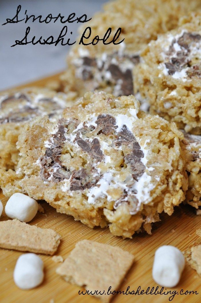 some cookies and marshmallows are on a cutting board