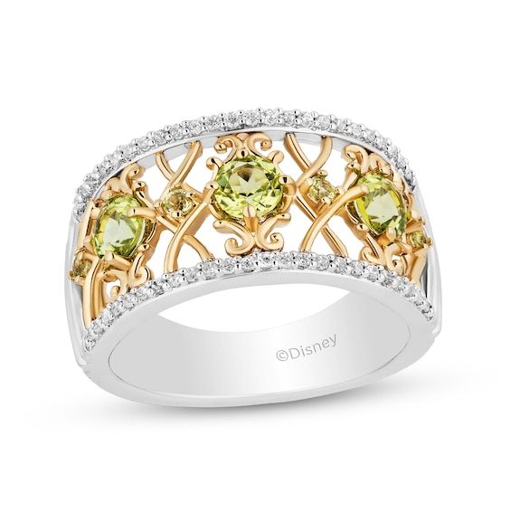 This openwork ring from Enchanted Disney inspired by Tiana is simply a magical look. Sterling silver and 10K gold Larger round green peridot alternate with smaller peridot atop a scroll-patterned center Sparkling round diamonds line the top and bottom edges 1/5 ct. t.w. of diamonds ©Disney Tiana Wedding, Disney Tiana, Ornate Ring, Enchanted Disney, Princess Tiana, Scroll Pattern, Green Peridot, Disney Inspired, 10k Gold