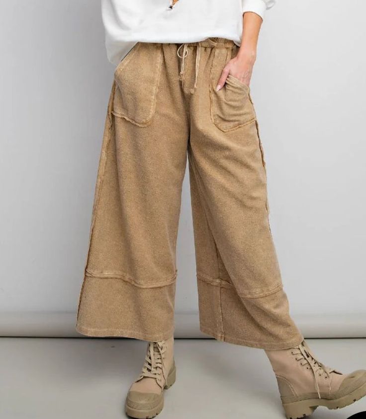 The Easel pants are a soft terry mineral washed fabric with a wide leg palazzo style. They feature exposed seams, a loose fit, and a drawstring waist. Pair these with your favorite Easel top! Waist measurements are from material being unstretched Material and Care 100% cotton Hand wash cold Hang to dry Measurements Small Waist:28" Length:36.5” Inseam:25.5” Medium Waist:30" Length:37” Inseam:26” Large Waist:32” Length:37.5” Inseam:26.5” Soft-washed Wide Leg Bottoms For Fall, Fall Soft-washed Wide Leg Bottoms, Soft-washed Wide Leg Pants For Spring, Comfortable Cotton Wide Leg Pants For Fall, Casual Soft-washed Wide Leg Pants, Casual Wide Leg Soft-washed Bottoms, Cotton Wide Leg Pants With Drawstring For Fall, Comfortable Wide Leg Pants With Drawstring, Washed Bottoms For Loungewear In Fall