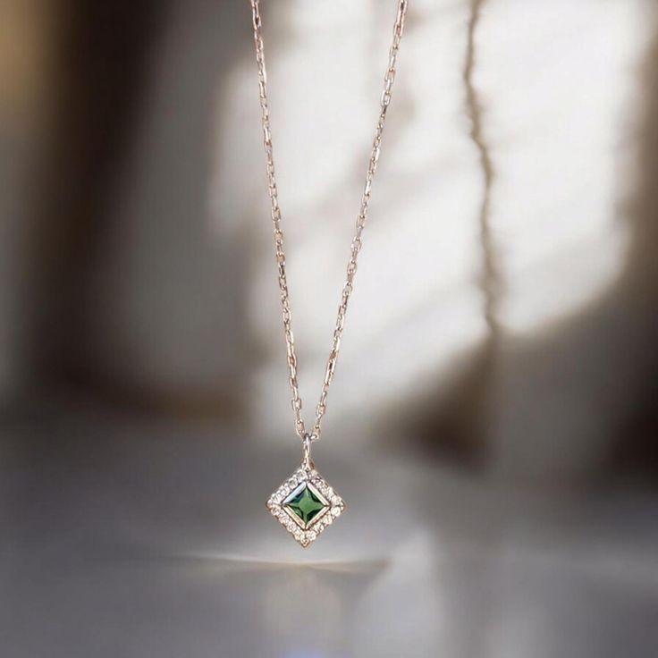 ✨COCOMIA ELITE EMERALD SQUARE PAVE NECKLACE✨  Width: 0.20 inches (5 mm) 📏 | Length: 0.20 inches (5 mm) 📏 | Height: 0.12 inches (3 mm) 📏  ⚖️Weight: 0.061 ounces (1.75 grams)  Discover Elegance: Elevate your style with our exquisite Emerald Square Pave Necklace. ✨ Featuring a high-quality Green Zircon Pendant 💎, this piece adds sophistication to any outfit. Perfect for everyday wear and special occasions 🎊. Casual Chic: Pair this elegant necklace with a simple blouse and jeans for a sophisticated, everyday look. The minimalist design ensures it complements various outfits without overpowering them.  Special Occasions: Perfect for weddings 💍, anniversaries 🎉, or any significant event, this necklace adds a touch of luxury and personal flair. The August birthstone makes it a memorable gi Elegant Rectangular Necklaces For Wedding, Elegant Rectangular Wedding Necklaces, Delicate Green Necklace For Wedding, Elegant Square Necklaces For Anniversary, Dainty Rectangular Birthstone Necklace, Square Pendant Jewelry With Delicate Chain For Anniversary, Delicate Chain Jewelry With Square Pendant For Anniversary, Elegant Square Pendant Jewelry For Anniversary, Elegant Square Pendant Jewelry For Anniversary Gift