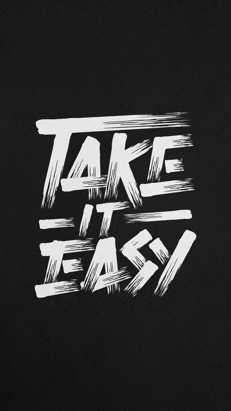 the words take it easy written in white ink on a black background with brush strokes