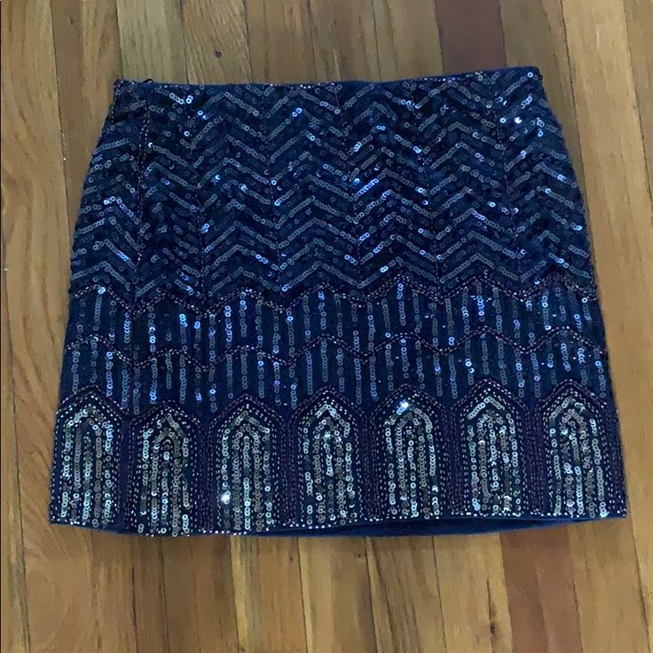 Navy Blue And Gold Sequined Romeo + Juliet Mini Skirt Never Worn Size Medium Gorgeous & Great For A Party Invisible Zipper On Left Side. Length Appx 15 1/2" Waist Appx 30” Elegant Blue Bottoms With Sequins, Elegant Blue Sequined Bottoms, Elegant Blue Sequin Bottoms, Glamorous Blue Sequined Skirt, Blue Evening Bottoms For Party Season, Blue Bottoms For Evening And Party Season, Blue Bottoms For Evening Party Season, Blue Sequined Mini Skirt For Party, Glamorous Blue Skirt For Party Season