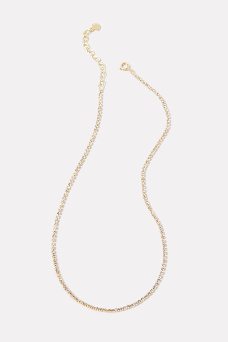 Add a little shimmer to your look with this stunning Gorjana necklace featuring genuine white crystals and 18k gold plating—perfect for special occasions or everyday wear. Elegant Gold-tone Charm Necklaces, Elegant Long Rhinestone Clavicle Necklace, Elegant Gold Plated Clavicle Chain Necklace, Elegant Gold Plated Crystal Clavicle Necklace, Elegant Gold Plated Clavicle Chain Crystal Necklace, Elegant Gold Plated Crystal Clavicle Chain Necklace, Elegant Gold-plated Crystal Clavicle Necklace, Elegant Crystal Necklace With Delicate Chain For Party, Elegant Gold Plated Long Charm Necklaces