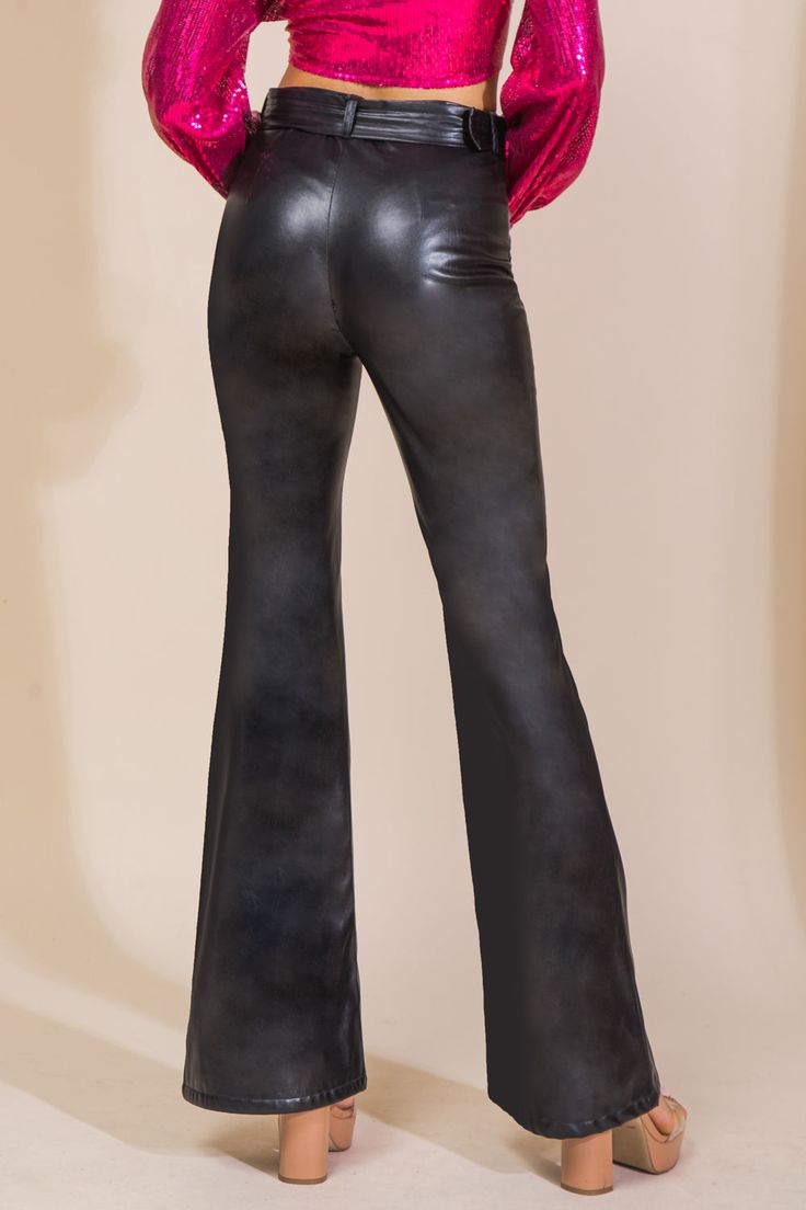 A faux leather pant featuring flare leg with center seam and self belt Details Self: Coating: 100% Polyurethane Ground: 100% Polyester Size & Fit - Model is 5`8" And Wearing Size Small - Measurements Taken From Size Small - Approx. Length: 45" Sleek Flare Pants For Fall, Elegant Flare Leather Pants, Elegant Flared Leather Pants, Faux Leather Wide-leg Pants For Fall, Fall Wide-leg Faux Leather Pants, Elegant Flare Leather Pants For Fall, Trendy Faux Leather Wide-leg Pants, Trendy Wide-leg Faux Leather Pants, Elegant Flared Leather Pants For Night Out