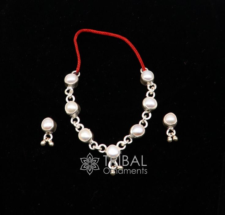 "Vintage antique style handmade sterling silver Idol Bal Krishna  necklace, child Krishna beaded necklace , Silver flute. Amazing customized silver temple art, silver article or utensils. Metal:- 925 sterling Silver Item type-Silver Krishna necklace. Weight-6.460 grams. length-2\"(fit for regular size Laddu Gopala.)we can use thread for customization of length.) Width-6 mm Makes excellent gifting and collectible pieces." Handmade Temple Jewelry Pearl Necklace With Round Beads, Silver Jewelry Sets For Puja And Festivals, Silver Sterling Silver Pearl Necklace With Polished Beads, Silver Temple Jewelry Sets For Puja, Silver Pearl Necklace With Polished Beads In Sterling Silver, Silver Jewelry Sets For Ceremonial Festivals, Ceremonial Silver Jewelry Sets For Festivals, Sterling Silver Beads Jewelry For Puja, Sterling Silver Beaded Jewelry For Puja