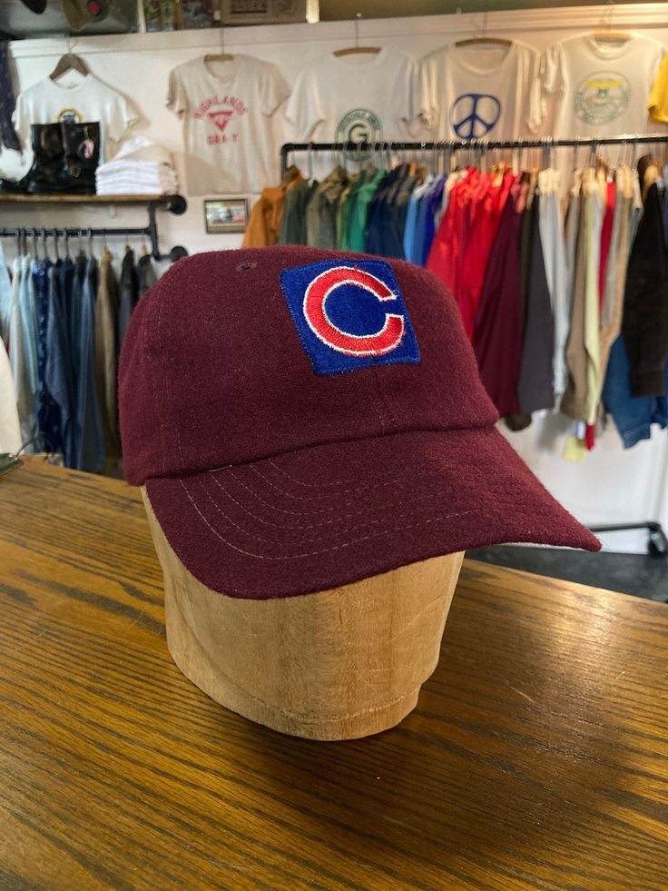 "1950s kids little league baseball cap  leather band with elastic  size adult small approximately 6 7/8  - - - - - - - - - - - - - - - - - - - - - - - - - - - - - - - - - - - - - - - -  INTERNATIONAL SHIPPING AVAILABLE UPON REQUEST Craft Union does NOT accept returns or exchanges, all items are FINAL SALE Please consider the following prior to placing an order : Because measurements are provided, Craft Union does NOT grant refund/exchange requests if an item does not fit. We are always happy to assist interest buyers with any size/fit concerns using the \"ask a question/message\" feature! Most vintage & antique items are rarely found in new/unused condition, visible age and wear often adds to their value and desirability so imperfections of all kinds are to be expected. Any significant dam Vintage Baseball Cap For Baseball Season, Retro Six-panel Fitted Hat For Baseball Season, Retro Six-panel Hat For Baseball Season, Vintage Six-panel Baseball Cap For Baseball Season, Retro Six-panel Baseball Cap For Baseball Season, Retro Six-panel Baseball Hat, Retro Six-panel Baseball Cap For Sports, Vintage Red Six-panel Baseball Cap, Retro Six-panel Sports Hat