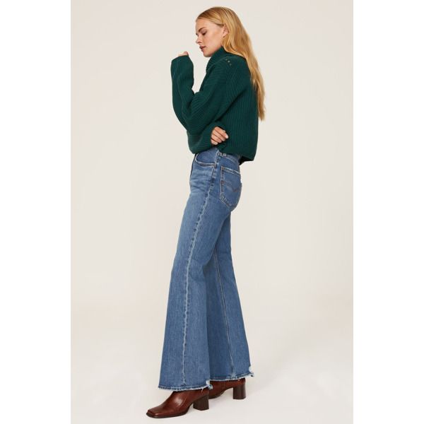 Blue denim (84% Cotton, 15% Cotton, 1% Elastane). Jeans. Front zipper fly with button closure. 32" inseam. 12.5" rise. Imported. Denim Flare Jeans With Frayed Hem For Fall, Denim Blue Cropped Jeans With Frayed Hem For Fall, Fall Denim Blue Bottoms With Frayed Hem, Fall Cropped Denim Blue Jeans With Frayed Hem, Fall Denim Blue Flare Jeans With Frayed Hem, Fall Flare Jeans With Frayed Hem In Denim Blue, Fall High Rise Washed Blue Jeans, Fall High-rise Washed Blue Jeans, Fall Washed Blue High Rise Jeans