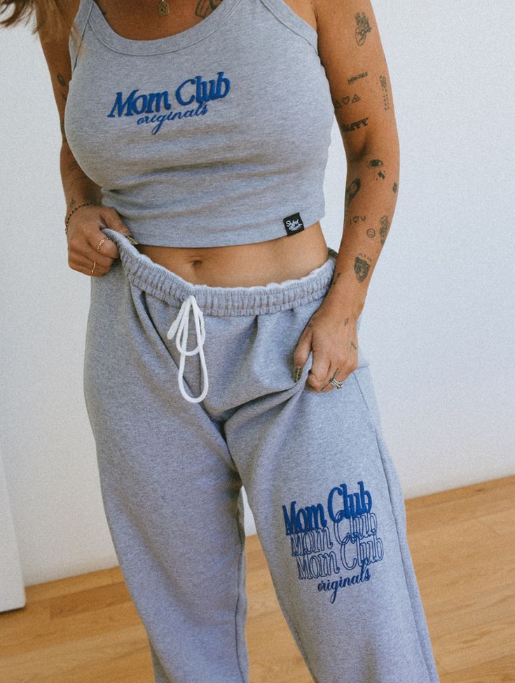 Level up your loungewear game with our Gray Mom Club Open Bottom Sweatpants – the epitome of chic comfort! Crafted from soft, high-quality fabric in a versatile shade of gray, these sweatpants redefine trendy relaxation. Featuring a stylish "Mom Club" puff print, they effortlessly combine fashion and function, allowing you to slay the mom duties in absolute style. 👖👩‍👧‍👦✨ #MomClubChill #TrendyMomEssentials Size chart in images :) Comfortable Gray Sweats For Loungewear, Comfortable Gray Sweatpants For Loungewear, Gray Athleisure Joggers For Lounging, Gray Joggers With Comfort Waistband For Loungewear, Comfortable Gray Joggers For Lounging, Sporty Gray Joggers For Lounging, Sporty Cotton Sweatpants For Relaxation, Comfortable Gray Sweatpants For Lounging, Comfy Gray Loungewear Pants