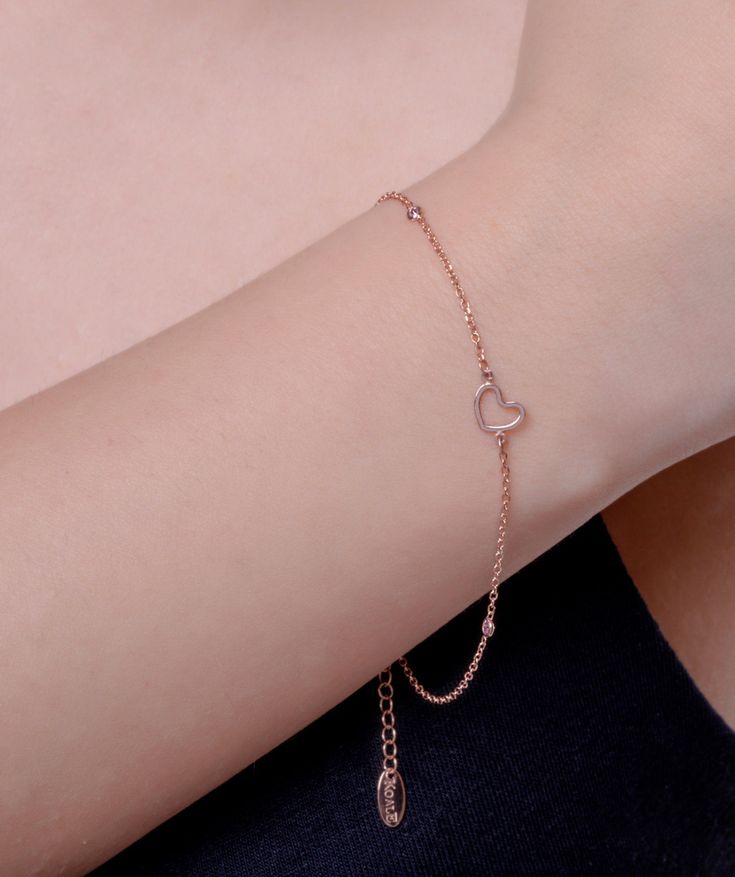 This gold heart is made of solid gold, and is set with 3 pink CZ stones! Express your love with this stylish and captivating bracelet! A perfect love gift for her. ✔ Made to Order ✔ Gold Kt: 9k-14K-18k ✔Metal stamp: 375-585-750 ✔ Available Gold Color: Rose Gold, Yellow Gold, White Gold ✔ Stone Cut: Round ✔ Number of Stones: 3 ✔ Setting Type: Prong ✔ Type of stones: CZ ✔ Bracelet size: Available in any lengths ( double link is an option) ✔ Dimensions (heart): 6,5MM ✔ Gold weight: 1 grams * ✔ Read Elegant Pink Bracelet With Heart Charm, Heart-shaped Yellow Gold Bracelets With Cubic Zirconia, Yellow Gold Heart Bracelet In Cubic Zirconia, Heart-shaped Yellow Gold Cubic Zirconia Bracelets, Yellow Gold Heart-shaped Cubic Zirconia Bracelets, Yellow Gold Heart Bracelet With Cubic Zirconia, Yellow Gold Cubic Zirconia Heart Bracelet, Heart-shaped Diamond Bracelet With Heart Charm, Rose Gold Chain Bracelet For Valentine's Day