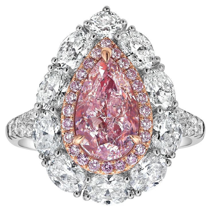 This exquisite piece features a 2.01 carat GIA-certified Very Light Pink diamond at its center, with I1 clarity. Surrounded by 1.70 carats of sparkling diamonds, the design showcases a delicate yet luxurious look. Handcrafted in 18k white gold, this ring exudes elegance with a contemporary twist. One of its standout features is the detachable head, allowing it to be worn as a pendant for added versatility. Whether worn as a ring or a pendant, this piece seamlessly adapts to your style, making it Luxury Gia Certified Pear-shaped Rings, Luxury Pear-shaped Gia Certified Rings, Gia Certified Teardrop Diamond Ring In Fine Jewelry Style, Elegant Gia Certified Pear-shaped Diamond Ring, Gia Certified Teardrop Diamond Ring Fine Jewelry, Elegant Gia Certified Teardrop Diamond Ring, Exquisite Pear-shaped Diamond Ring With Halo Setting, Luxury Pear-shaped Cubic Zirconia Diamond Ring, Luxury Pear-shaped Diamond Ring With Halo Setting