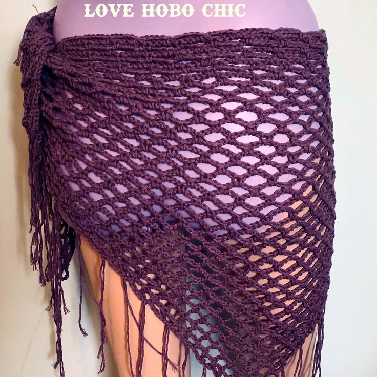 Scallop pattern mesh lace crochet triangle shawl/sarong with fringe.  The pattern is open and light, perfect for a beach cover up, or a light spring neck or head scarf. It is made with a light 100% cotton yarn, in a purple grape color Measures 60" X 30" not including the fringe, each fringe is about 7" long This item is washable, and durable. For best results wash as follows:  Gentle wash in cold Hang dry or dry flat This item is handmade with love by me! Check out my more wraps and other items at my shop here: https://www.etsy.com/shop/LoveHoboChic One Size Beach Shawl With Fringe, Summer Lace Shawl, Handmade Bohemian Shawl For The Beach, Scallop Crochet Pattern, Bohemian Open Knit Shawl, Bohemian Crochet Lace Shawl For Summer, Beach Crochet Shawl One Size, Summer Beach Crochet Shawl, Crochet Shawl For Summer Beach