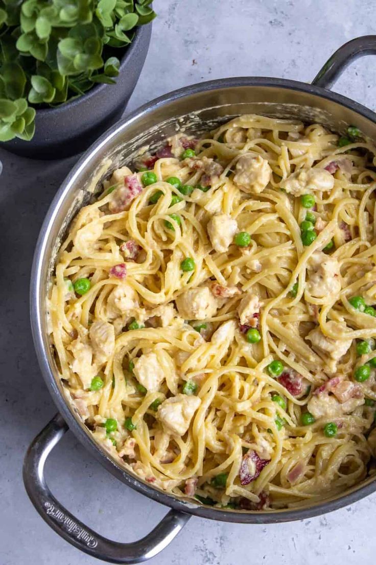 a large pot filled with pasta and peas