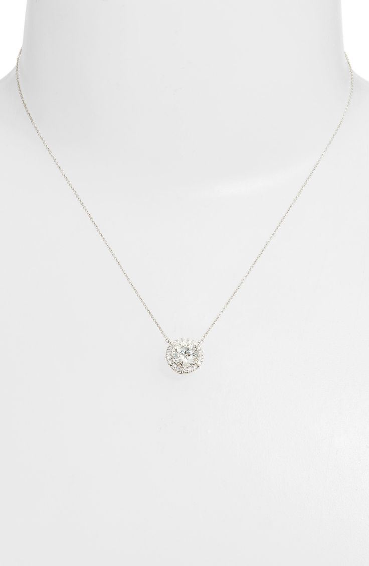 This stunning necklace is crafted with a center lab-grown-diamond pendant that's haloed by sparkling pavé stones and suspended from a delicate chain. 16" length; 2" extender; 3/8" pendant diameter   Total lab-grown-diamond weight: 2ct.   Color: G–J   Clarity: VS   14k gold/lab-grown diamond   Imported   >Diamond Guide Halo Pendant Diamond Necklace With Cubic Zirconia, Cubic Zirconia Halo Pendant Diamond Necklace, Halo Pendant Cubic Zirconia Diamond Necklace, Halo Cubic Zirconia Pendant Diamond Necklace, Anniversary Cubic Zirconia Halo Necklace, Fine Jewelry Diamond Pendant Necklace With Halo Setting, Sterling Silver Diamond Pendant Necklace With Halo, Dazzling Cubic Zirconia Diamond Necklace With Halo Design, Luxury Silver Diamond Necklace With Halo