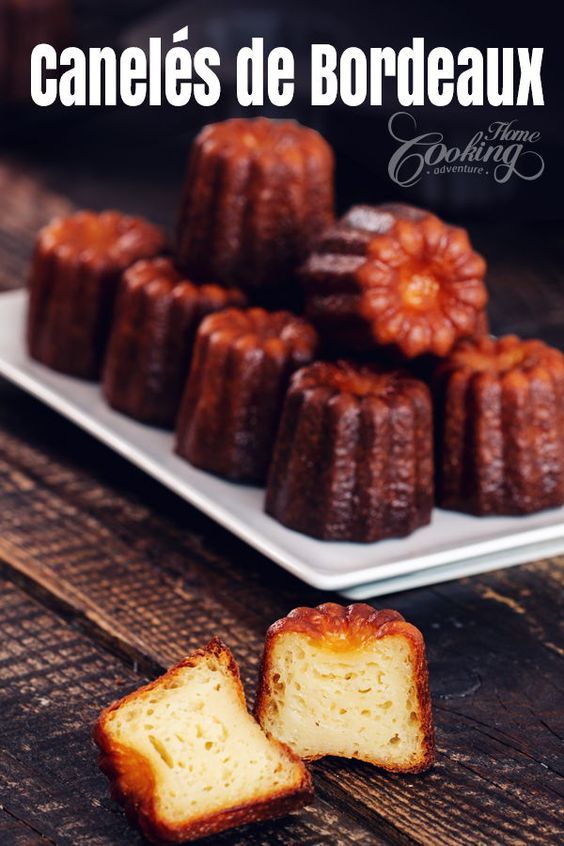 some bundts are on a white plate and one is cut in half