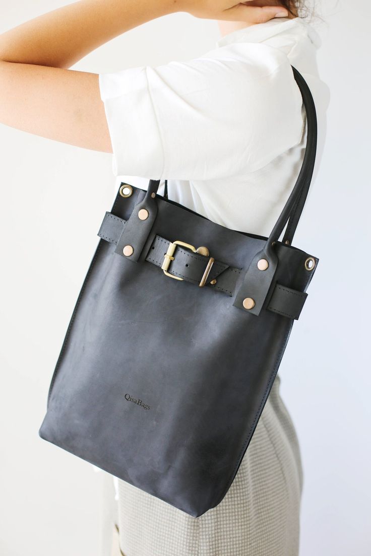 Designer Handbags for women | Leather Purse Black Formal Handheld Leather Bucket Bag, Handheld Leather Bucket Bag For Office, Timeless Leather Bucket Bag For Business, Timeless Leather Business Bucket Bag, Chic Daily Use Shoulder Bag With Leather Strap, Leather Bucket Bag With Top Carry Handle For Office, Chic Tote Shoulder Bag With Leather Strap, Formal Black Bags With Leather Strap, Luxury Everyday Leather Backpack