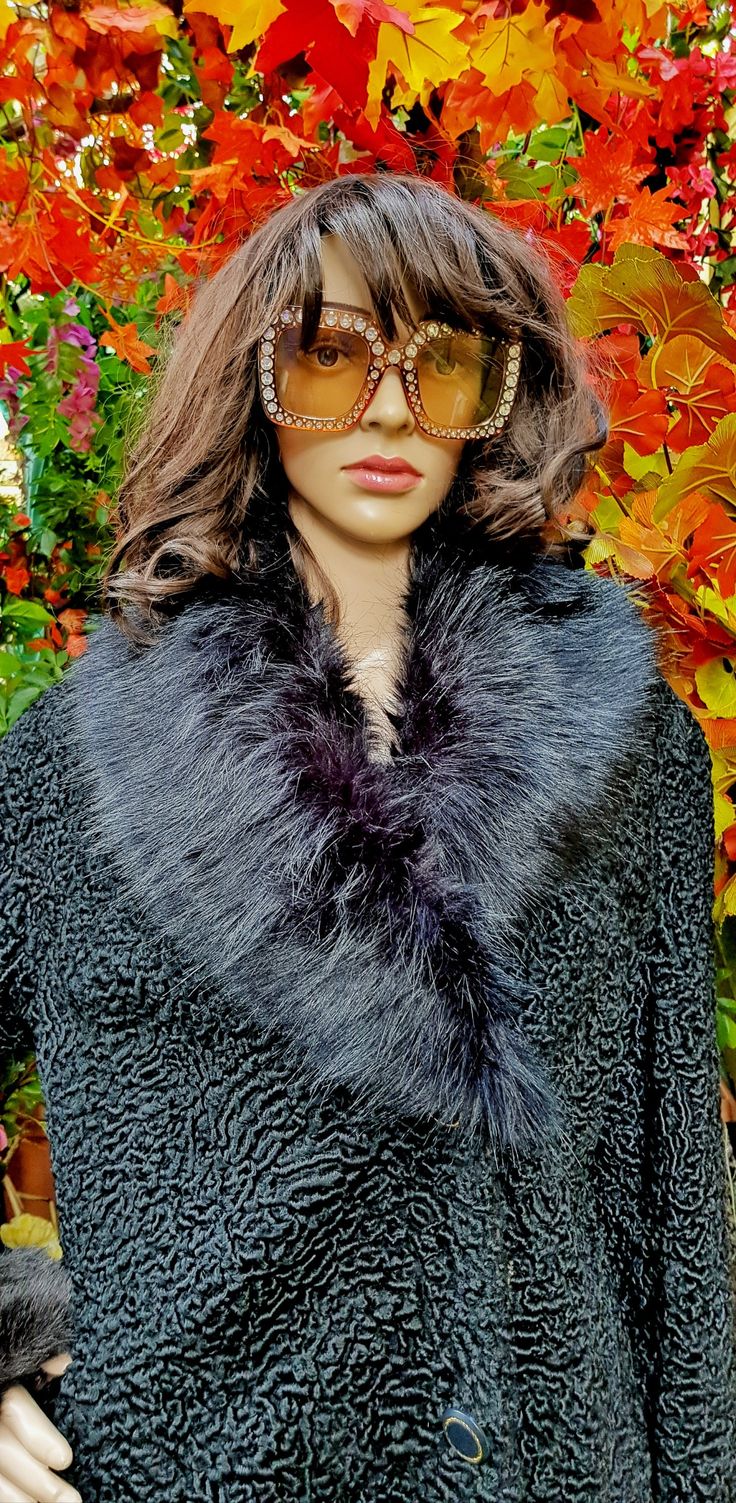 "Lovely vintage 1990s black faux fur collar. No label so brand unknown Gorgeous thick fluffy faux fur.   Black satin feel fabric on reverse side. Small black elastic loops to attach to garment Very versatile and can be used to change the look and add a touch of glamour to coats or cardigans. Material: synthetic fibres. A lovely retro glamerous piece. Condition: The piece has been carefully hand washed and is in very good vintage condition. Measurements: Max Length: 38 inches Max Width: 4 1/2 inches About: \"Mijkra\" is a UK based artist/photographer and designer creating and sourcing unique original pieces in a converted stable/barn in the heart of Oxfordshire and in the back of a vintage campervan. This store, hosted by Etsy, will showcase and sell a range of unique artisan bohemian hand Black Faux Fur Coat For Cold Weather, Black Fur Coat With Faux Fur Trim, Black Faux Fur Coat With Faux Fur Trim, Black Faux Fur Coat For Winter, Black Fluffy Fur Coat For Cold Weather, Fluffy Black Fur Coat For Cold Weather, Fitted Black Faux Fur Coat, Black Fur Coat With Faux Fur Trim For Party, Black Fur Coat With Faux Fur Lining For Party