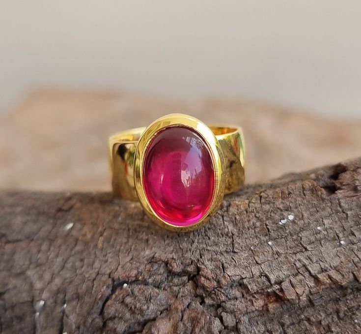 18k Gold Vermeil Ruby Ring, Statement Ring, Cabochon Red Ruby, Red Cherry, Rare Stone, Matte Gold Bezel Setted, Wedding ring, Gift for her PRODUCT DETAIL Product               :  Ring Metal                    : Sterling Silver (18K Yellow Gold Plated) Metal Purity        :  925 Total Weight       :  9.2 GMS (Approx.) Ring Size             :  All Size Metal   925 Solid Sterling Silver (18K Yellow Gold Plated) GEMSTONE DETAILS  Stone Name          :   Ruby  Stone Shape         :   Oval 10x14 mm St Yellow Gold Cabochon Ruby Ring, Red Oval Cabochon Jewelry With Polished Finish, Handmade Red Oval Cabochon Jewelry, Red Ruby Round Band Jewelry, Ruby Cabochon Round Jewelry, Red Oval Cabochon Jewelry For Anniversary, Red Bezel Setting Fine Jewelry, Red Bezel Setting Ring, Red Bezel Set Ring Jewelry