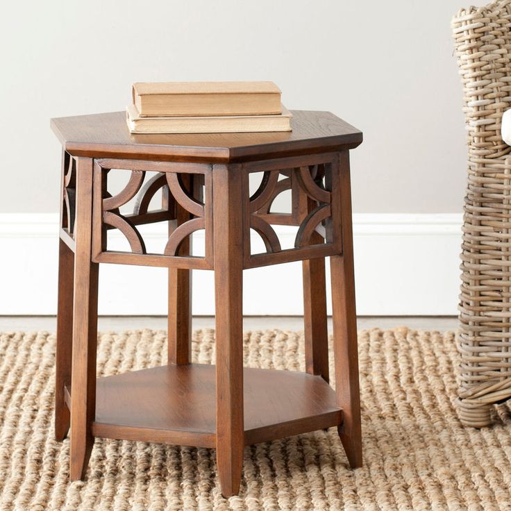 a small wooden table with a book on top