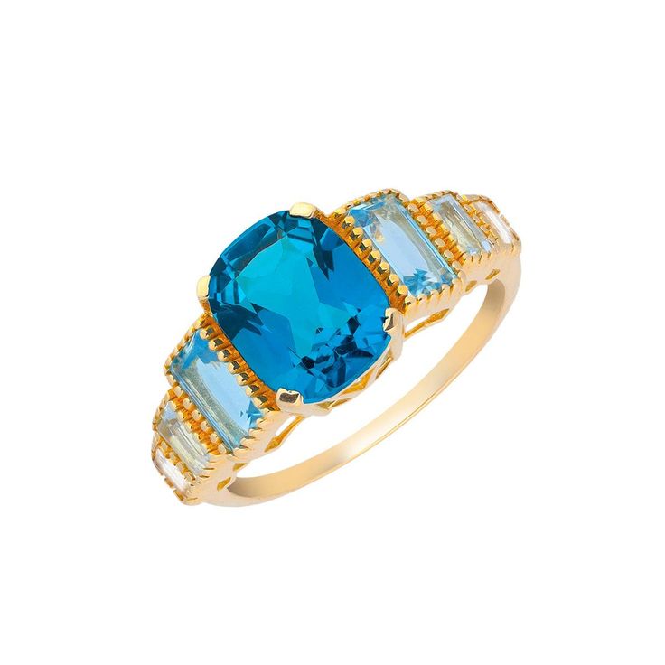 an oval blue topazte and baguette diamond ring with yellow gold accents