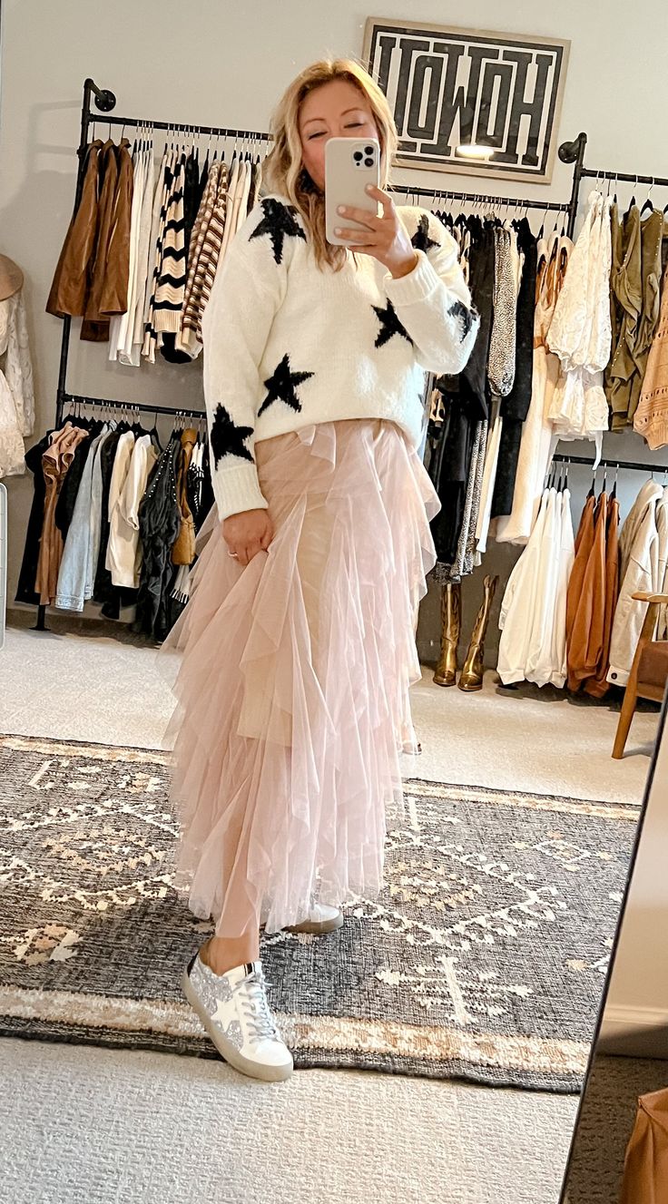 Bust out your twirling shoes for this Tulle Skirt! This whimsically romantic piece features a playful ruffle, voluminous tulle, and a midi length. Crafted in a classic neutral linen color, it’s the perfect piece to pair with your favorite holiday top or winter sweater! Get ready to twirl! True to size; elastic waistband - YES! Tulle Skirt Winter Outfit, Fall Tulle Pleated Skirt, Fall Pleated Tulle Skirt, Fall Party Tulle Bottoms, Fall Tiered Tulle Skirt, Chic Tulle Skirt For Fall, Fall Tulle Long Skirt, Fall Full Tulle Skirt, Fall Season Full Tulle Skirt