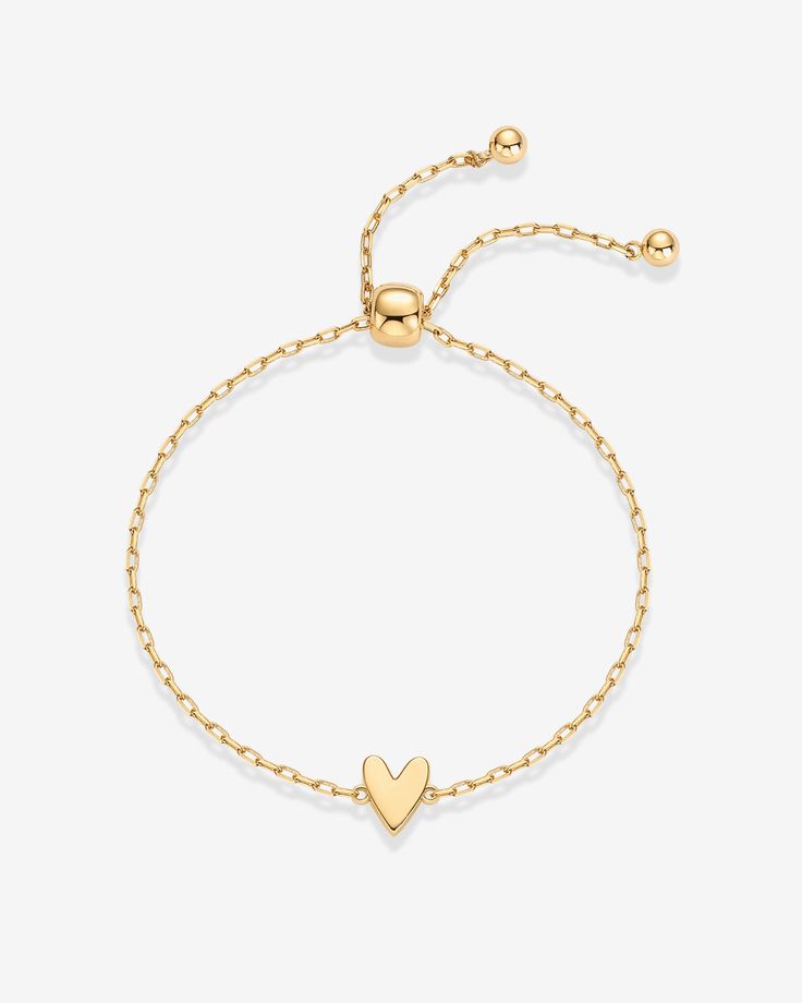 Wrap your wrist in elegance with our stunning bracelet, crafted with 14K yellow gold plating for a long-lasting finish. Enjoy peace of mind knowing it's 100% nickel-free, cadmium-free, lead-free, and hypoallergenic, making it suitable for sensitive skin. Elevate your style effortlessly with this timeless piece that adds a touch of sophistication to any ensemble.Materials: 14K Yellow Gold or Rhodium plated. Measurements: Length: 9" with an adjustable slider . Hypoallergenic; nickel, lead, and cad Solitaire Bracelet, Gold Plating, Heart Charm, Rhodium Plated, Timeless Pieces, Sensitive Skin, Gold Plate, Long Lasting, Plating