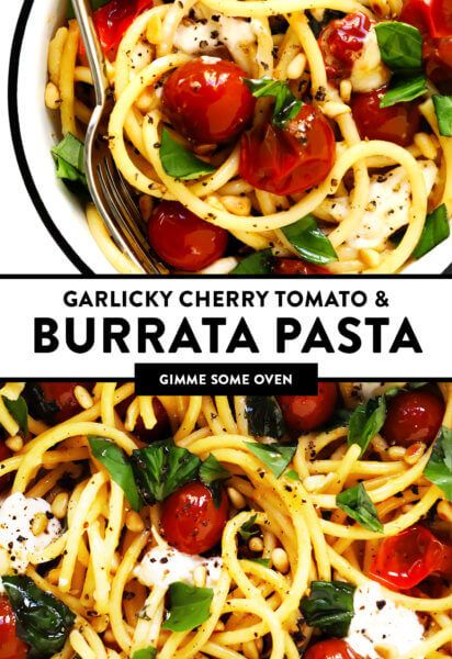 a bowl filled with pasta and topped with cherry tomatoes