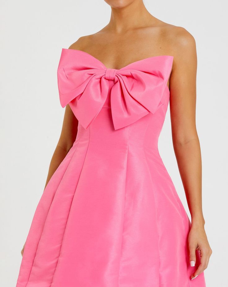 This chic and playful mini dress features a strapless neckline and a dramatic oversized bow for a statement look. The fit and flare silhouette creates a flattering shape, perfect for any special occasion. Crafted from high-quality fabric, this dress combines elegance with a touch of fun, making it a must-have addition to your wardrobe. Mac Duggal Crepe fabric (100% Polyester) Fully lined through body Strapless neckline Sleeveless Statement bow featured mid-bust Concealed back zipper Approx. 35" Sage Green Mini Dress, Destination Wedding Guest Dress, Fall Formal Dresses, Mini Dress With Bow, Bow Fashion, Dress Night Out, Party Dress Sale, Fall Wedding Guest Dress, Strapless Neckline