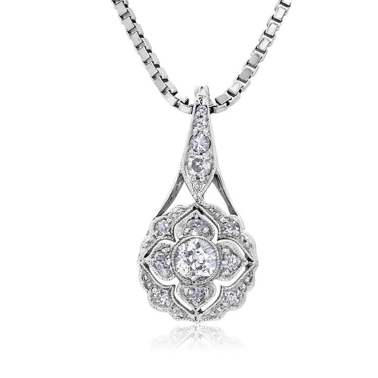 This is part of Chairish’s Fine Jewelry assortment.  Introducing the exquisite Art Deco Floral Diamond Pendant Necklace—a true embodiment of timeless elegance and sophistication. Crafted with meticulous attention to detail, this captivating piece showcases a dazzling 0.55 carat diamond set in a lustrous 18-karat white gold setting. The pendant's design draws inspiration from the Art Deco era, characterized by its geometric patterns and intricate motifs. The centerpiece of this necklace features a brilliant round-cut old European diamond, meticulously chosen for its exceptional clarity and radiance. The diamond's facets are expertly cut to maximize its brilliance, reflecting light from every angle and creating a mesmerizing play of sparkle. One Old European center diamonds weighing 0.20 car Luxury Platinum Bridal Necklace For Formal Occasions, Classic Platinum Bridal Necklace For Formal Occasions, Luxury Platinum Bridal Necklace With Diamond Accents, Formal Platinum Bridal Necklace, Classic Silver Diamond Necklace With Intricate Design, Classic White Gold Platinum Bridal Necklace, Luxury Diamond Cut Flower Pendant Necklace, Heirloom Diamond Necklace With Intricate Design, Luxury Oval Necklace With Intricate Design