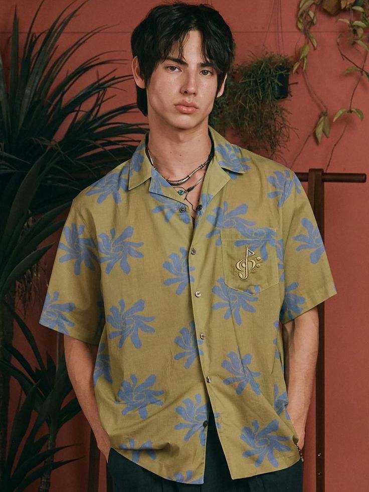 This is a comfortable and unique shirt by 2113 studio that is made out of high quality and sturdy material. With distinctive mood of the design and comfortable wear, you can style it for your casual summer outfit.- Unique and bold graphics printed - Color contrasting top button detail- Reversed pocket and back label detail- Casual and trendy mood Summer Tops With Graphic Design In Relaxed Fit, Relaxed Fit Graphic Summer Tops, Relaxed Fit Summer Tops With Graphic Design, Summer Green Tops With Graphic Design, Green Graphic Design Summer Top, Trendy Printed Cotton Camp Shirt, Trendy Graphic Print Camp Shirt With Short Sleeves, Trendy Graphic Print Short Sleeve Camp Shirt, Summer Graphic Cotton Shirt