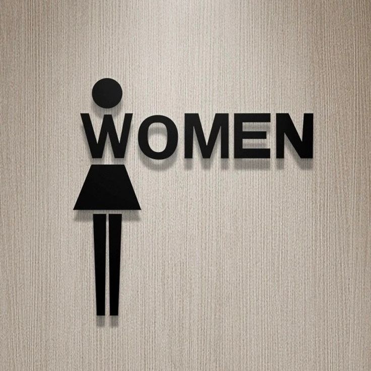 the word women written in cutout paper with a woman's silhouette on it