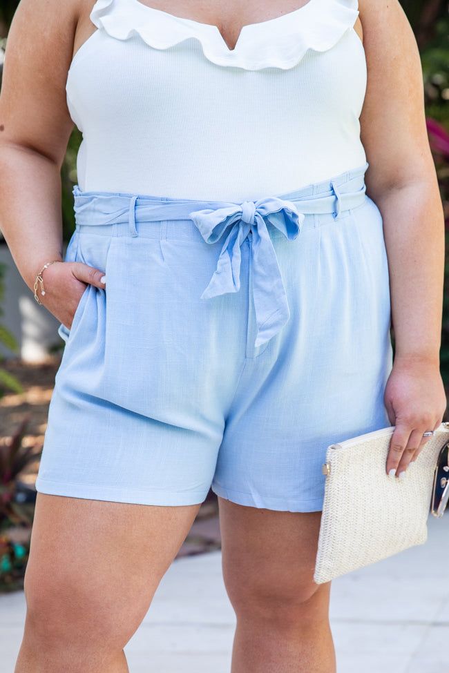 Details Light blue shorts Stretch in waist, fabric has no stretch High waist paperbag style with a tie accent and pockets Pair these shorts with a bodysuit and wedges Unlined Size small from waist to hem: 14" Material and Care 85% Cotton, 15% linen Machine wash cold / Tumble dry low Patterns may vary Materials may have natural variations Colors may vary from different viewing devices. Vacation Shorts With Elastic Paperbag Waist, Vacation Paperbag Waist Shorts With Elastic Waistband, Vacation Paperbag Waist Shorts With Elastic Band, Summer Beach Shorts With Paperbag Waist, Blue Bermuda Shorts For Spring Vacation, Blue Shorts For Day Out, Spring High-waisted Tie Waist Shorts, High Waist Tie Waist Shorts For Beach, Cotton Paperbag Waist Shorts For Beach