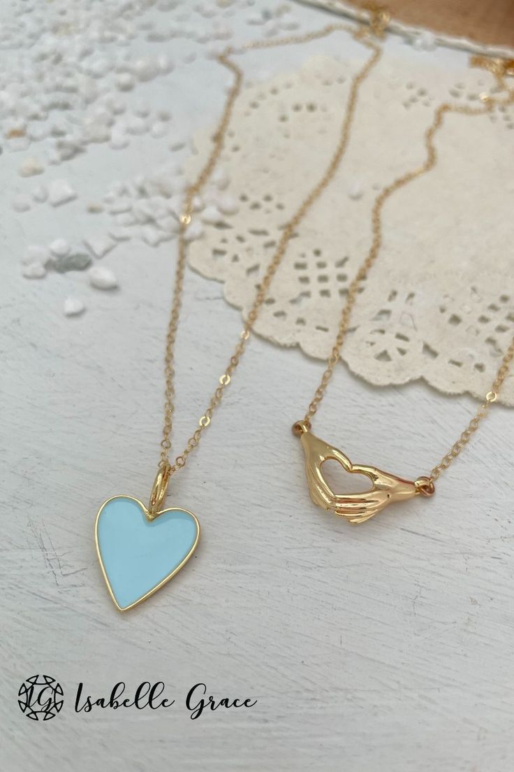 The color of summer shines bright in our Baby Blue Enamel Heart Necklace. A gorgeous and colorful addition to your collection. A beautiful enamel gold plated heart charm sparkles on a 14kt gold fill chain. Charm measures approximately 1/2 inch. Order your unique necklace here! Enamel Heart Charm Necklace For Gifts, Double Heart Enamel Jewelry For Gifts, Dainty Heart Necklace For Friendship, Gold Heart Charm Necklaces For Friendship, Turquoise Charm Necklace With Lobster Clasp As Gift, Personalized Blue Necklaces For Friendship, Dainty Turquoise Charm Necklace For Gift, Personalized Blue Necklace For Friendship, Heart-shaped Enamel Charms Necklaces