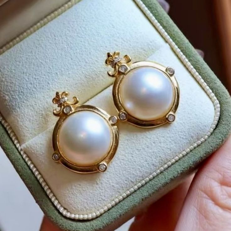 These stunning gold plated silver earrings feature a beautiful pair of hemisphere Mabe Pearl stones. With their intricate details and rich color, these push back studs are the perfect statement piece for any outfit. Handcrafted with care, these earrings are a true work of art and are sure to draw attention wherever you go. Whether you're looking for a unique gift or simply want to treat yourself. With their durable construction and timeless design, they're sure to become a beloved addition to yo White Round Clip-on Diamond Earrings, Anniversary White Diamond Clip-on Earrings, Classic Gold Plated Round Clip-on Earrings, Classic Gold Plated Clip-on Earrings For Anniversary, Classic Round Gold Plated Clip-on Earrings, Classic Gold Plated Round Diamond Earrings, Classic Round Diamond Earrings With Elegant Design, Classic Clip-on Diamond Earrings As A Gift, Timeless Round Pearl Earrings As Gift