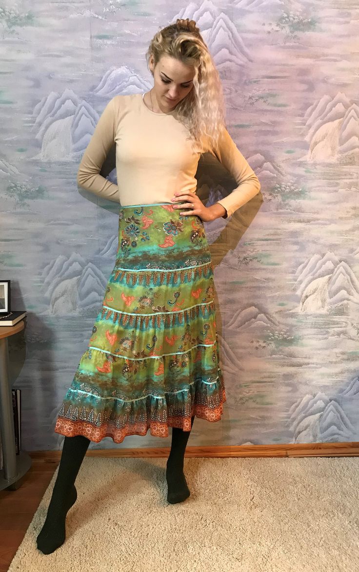 "Midi Light Green Floral Print Skirt Long Ruffled Skirt Gathered Skirt Twirl Skirt Bohemian Maxi Skirt Medium to Large Size Label size: NL 42; BF 44; GB 16 Estimated size: M/L Measurements: Length: 33,5\" / 85 cm Waist: 16\"/ 41 cm Please check measurements to insure a proper fit. Remember to allow yourself some extra room for movement. You can compare these with something from your closet that fits you well. This skirt will come to you freshly laundered and ready to wear. Please feel free conta Long Ruffled Skirt, Bohemian Maxi Skirt, Twirl Skirt, Bohemian Maxi, Skirt Medium, Green Floral Print, Ruffled Skirt, Skirt Long, Floral Print Skirt