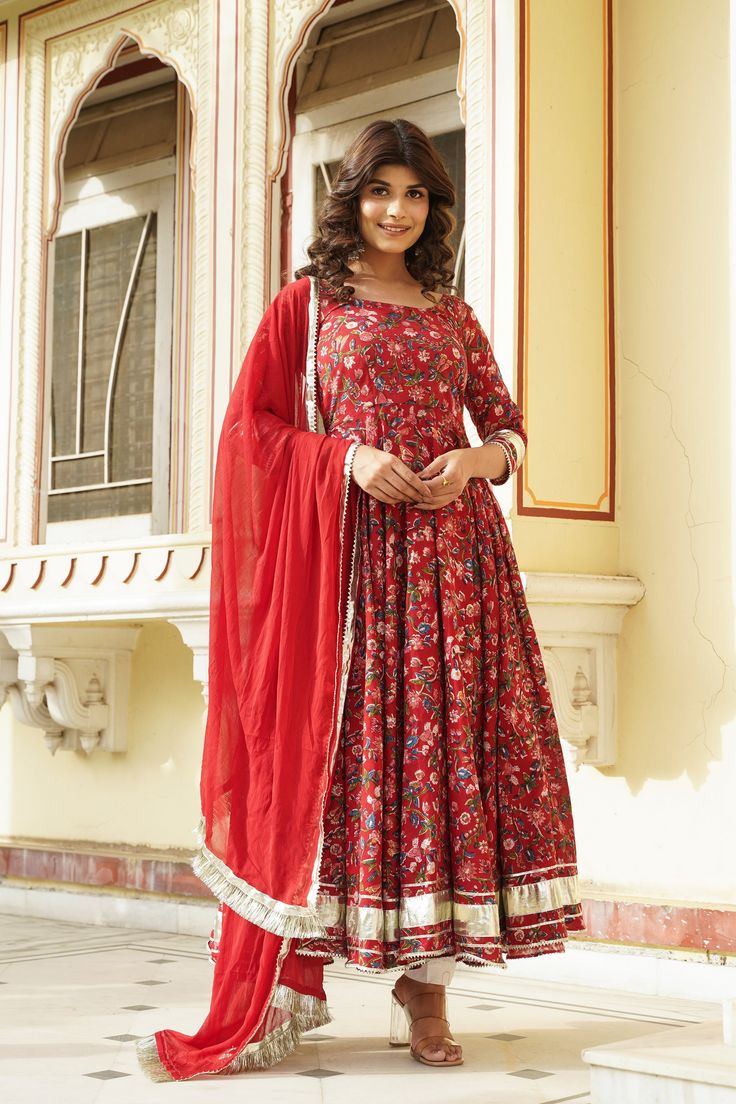 PRODUCT DESCRIPTION :-Look gorgeous this season in our rustic red hand block Anarkali set. With an eye - catchy floral print , it will definitely bloom joyful flowers in your heart.Anarkali :-Hand Block cottonPant :- CottonDupatta :- chiffonClosure Used:- Side zipColor:-Anarkali and dupatta - rustic red Pant - whiteCare Instructions :- Dry clean onlyModel Size :- Model is wearing XS sizeModel Height :- 5.7''DISCLAIMER :- Slight color variations may occur due to different screen resolution. Festive Kalamkari Print Churidar For Diwali, Red Chanderi Salwar Kameez With Printed Motifs, Red Anarkali Salwar Kameez With Printed Motifs, Red Cotton Anarkali Set For Diwali, Red Traditional Wear With Printed Motifs For Navratri, Floor-length Wedding Kurta With Kalamkari Print, Red Cotton Anarkali Set For Festivals, Traditional Anarkali Set With Kalamkari Print For Eid, Red Dupatta With Printed Motifs For Navratri