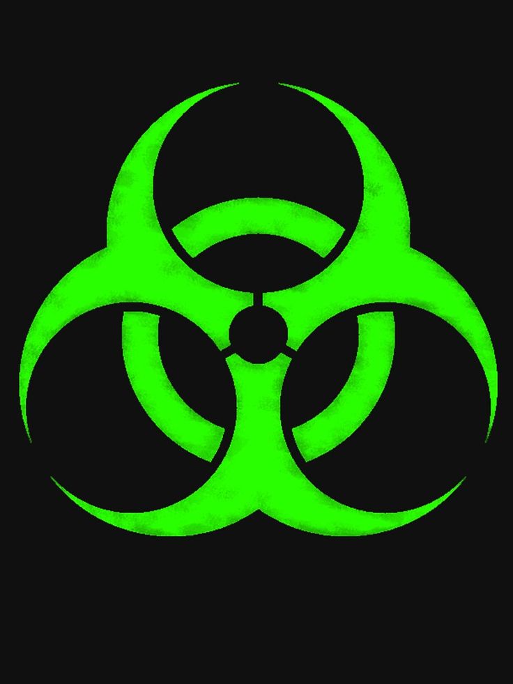 a green biohazard sign on a black background