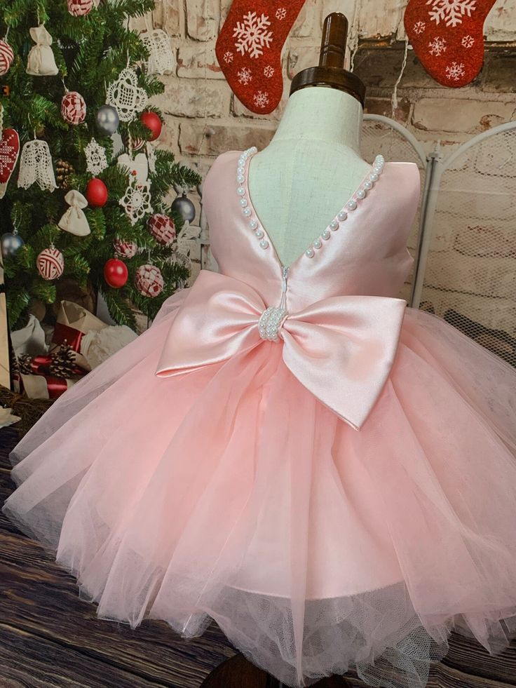 Celebrate the special occasions in your little one's life with our Soft Blue Pearl Baby Girl Tutu Dress. This enchanting ensemble adds a touch of elegance and glamour to any formal event with its soft blue color and delicate pearl accents. Made from the most comfortable, lightweight tulle, your little one will be able to move and play freely, while still looking party-ready. The satin waistband ensures a snug fit and adds charm with its beautiful bow detail. The dress's layered tutu skirt is ado Layered Tutu Skirt, Girls Tutu Dresses, Dress Layer, Fancy Dress Up, Girl Tutu, Baby Pearls, Princess Gown, Vintage Princess