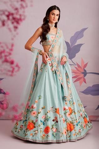 Sea green lehenga with floral printed motifs and embroidered waistband. Comes with sleeveless blouse and organza dupatta.
Component: 3
Pattern: Print and Embroidery
Type Of Work: Floral Print, Pearl and Cutdana
Neckline: Scoop
Sleeve Type: Sleeveless
Fabric: Silk and Organza
Color: Green
Other Details: 
Dupatta with floral printed border
Closure: Back zip
Occasion: Wedding - Aza Fashions Ridhi Mehra, Skirt Silk, Green Lehenga, Green Floral Print, Embroidered Wedding, Wedding Lehenga, Silk Lehenga, Organza Dupatta, Skirt And Blouse