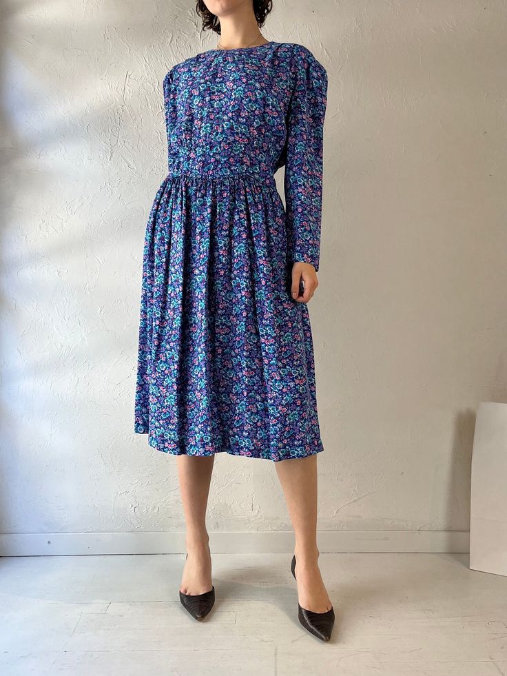 - Vintage Karen Stevens blue floral print dress - 100% rayon - Zipper up the back - Tagged 14 Bust: 19"  Waist: 14" Length: 44" We are not responsible for lost, stolen, or damaged packages once they have been shipped. Any additional customs duties or taxes incurred on international orders are the responsibility of the buyer. Please note that our items are vintage and may have minor flaws or imperfections due to their age, which adds to their unique character. Spring Blue Midi Dress With Ditsy Floral Print, Blue Midi Dress With Ditsy Floral Print For Spring, Blue Ditsy Floral Print Midi Dress For Spring, Fitted Blue Midi Dress With Ditsy Floral Print, Blue Ditsy Floral Print Knee-length Dress, Blue Floral Print Midi Dress In Viscose, Blue Floral Print Viscose Dress, Blue Floral Print Viscose Midi Dress, Blue Knee-length Ditsy Floral Dress