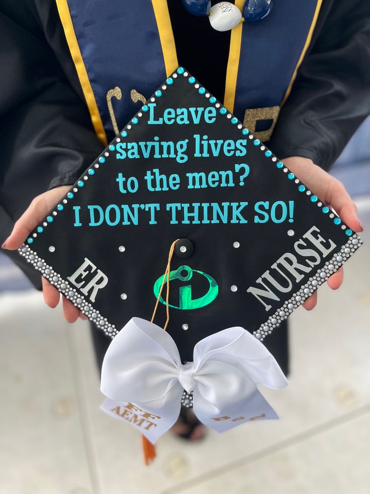 a person holding a graduation cap that says leave saving lives to the men i don't think so