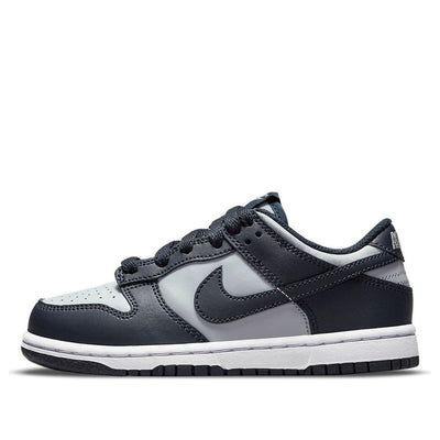 The Nike Dunk Low PS ‘Georgetown’ delivers a two-tone edition of the retro hoops shoe in the signature colors of the Hoyas. Made with a leather upper in Wolf Grey and Dark Obsidian overlays, this shoe is perfect for little kids who want to show their support for their favorite team. The Nike branding on the woven tongue tag and heel tab adds a touch of style, while the low-cut collar allows for a full range of motion. The perforated detailing at the toe box offers improved breathability, and the dark navy rubber outsole provides excellent traction. (SNKR/Skate/Casual/Low Top/Classic/Colorblock) Nike Dunk Low Georgetown, Trendy Shoes Sneakers, Cute Nike Shoes, Hype Shoes, Cute Nikes, Shoe Inspo, Swag Shoes, Grey Sneakers, Nike Dunk Low