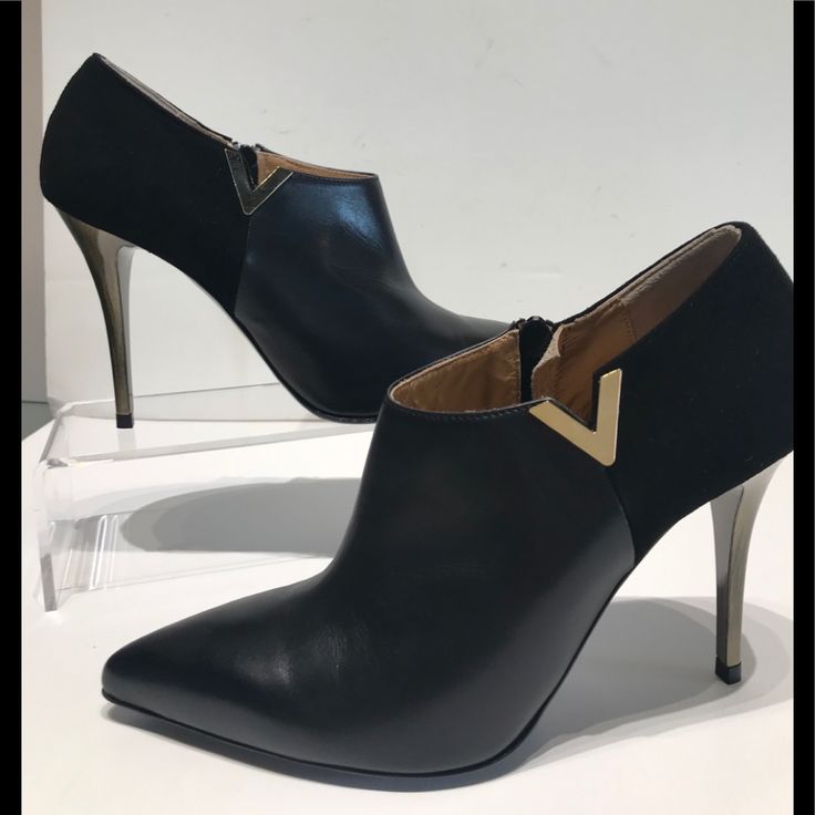 Gianni Ferrante Black Hh Gold Finish On The Heel Ankle Bootie With V Detail On The Side .Inside Zipper Easy To Get On ...Rubber Bottom For Comfort .Looks Great With Dresses And Skirts Because The Cute Of The Bootie On The Leg . Evening Ankle-high Boots With Contrasting Heel Counter, Formal Ankle-high Heels With Contrasting Heel Counter, Elegant Heeled Boots With Metal Feet, Formal Ankle Boot With Sculpted Heel, Formal High Heel Boots With Contrasting Heel Counter, Modern Ankle-high Evening Heels, Elegant Ankle-high Heeled Boots For Evening, Elegant Evening Ankle-high Heeled Boots, Evening Ankle Strap Heeled Boots With 4-inch Heel