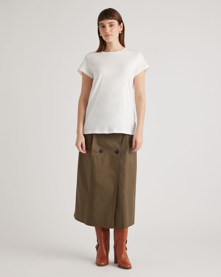 A wardrobe basic that feels anything but. Our Cotton Modal Crewneck Swing Tee is made with a super soft and stretchy cotton blend that's wrinkle-resistant with a seriously smooth finish.  | Quince | Women's Cotton Modal Crew Neck Swing Tee in White, Size Medium, Cotton/Modal Classic Stretch T-shirt For Workwear, Versatile Spring T-shirt For Casual Gatherings, Stretch T-shirt For Workwear In Fall, Casual Workwear T-shirt With Shirttail Hem, Versatile White Cotton T-shirt, Versatile Solid Color T-shirt For Fall, Versatile Solid T-shirt For Fall, Versatile Solid Color Fall T-shirt, Versatile Fitted T-shirt