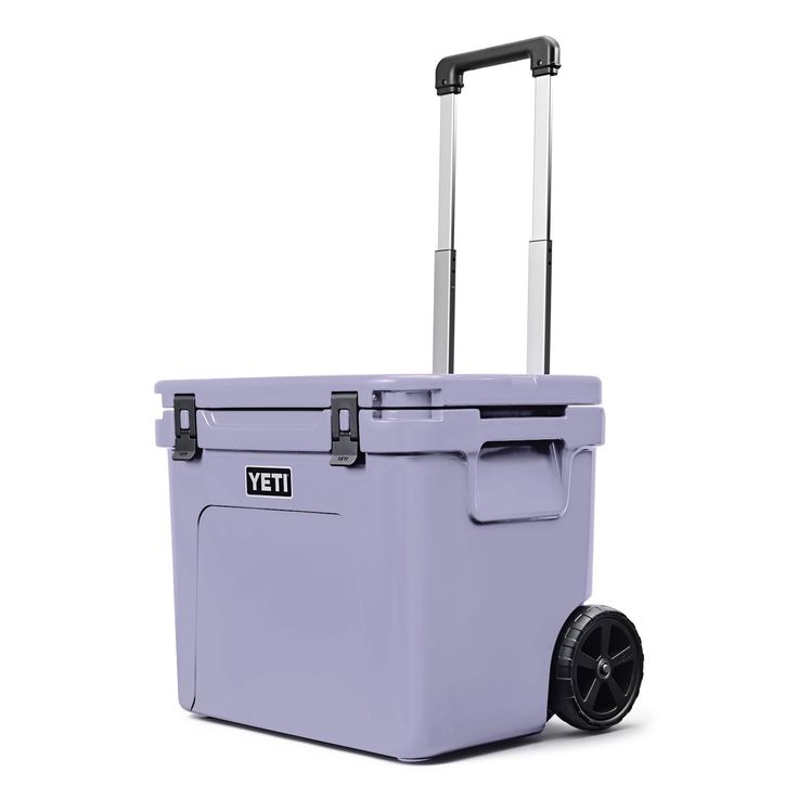 a purple cooler with wheels and handle on it's side, against a white background