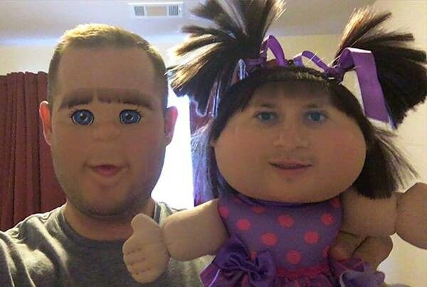 a man holding a stuffed animal doll next to a woman's face with big blue eyes