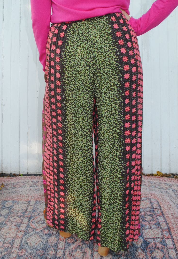 Get ready to harvest some compliments in these Boho-inspired pants! With a unique border print, elastic waist and hem, and side tie pockets, these pants offer both style and functionality. Perfect for a playful and fun-loving fashionista, these pants will make a statement while keeping you comfortable. -100% Rayon Hand Wash Cold Do Not Bleach Lay Flat to Dry Cotton Floral Print Patterned Bottoms, Floral Print Cotton Bottoms, Patterned Floral Print Cotton Pants, Patterned Cotton Bottoms With Floral Print, Floral Print Patterned Bottoms For Vacation, Spring Patterned Loungewear Pants, Patterned Floral Print Bottoms For Vacation, Patterned Pants With Elastic Waistband For Spring, Spring Patterned Bottoms With Relaxed Fit