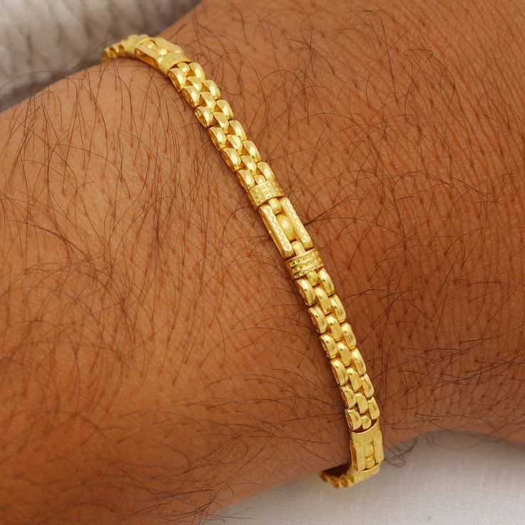 Please click -- Learn more about this item -- below for a full description 22k gold chain bracelet chain handmade jewelry made in India 22k yellow gold chain bracelet handmade jewelry for men Pretty gift for men, Indian gold 22kt jewelry Christmas Present  length is 7.5 Inch approx.  width is 4 millimeter approx.   weight is 11.31 grams approx. please message me if you have any query. Elegant Yellow Gold Bracelet For Puja, 22k Yellow Gold Chain Bracelet As Gift, 22k Yellow Gold Chain Bracelet Gift, 22k Yellow Gold Bracelet With Intricate Design, Yellow Gold 22k Chain Bracelet Gift, Intricate 22k Yellow Gold Bracelet, Formal 22k Yellow Gold Chain Bracelet, Gold-plated Gold Bracelets For Puja, 22k Yellow Gold Bracelet For Festivals