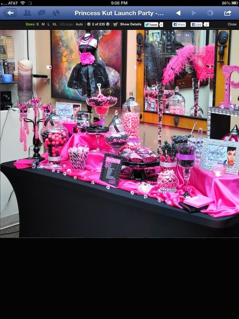 a table covered in pink and black decorations