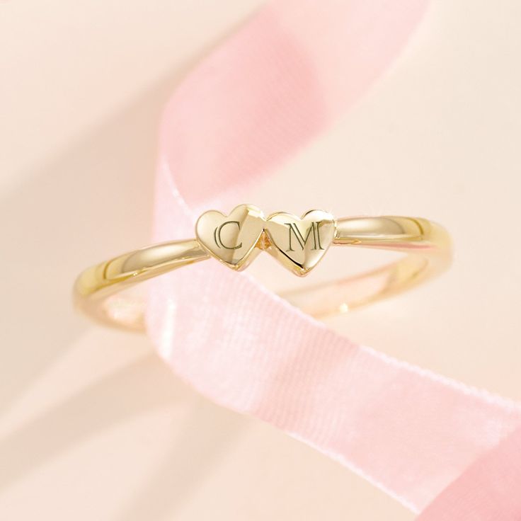 Made of solid 14k gold (not plated, not filled, not vermeil), this ring is available in your choice of yellow, white, or rose gold (as well as platinum upon request) This listing is for a two heart ring but this style is available with one, two, three, four, and five hearts. If you would like a different number of hearts for your ring, please message me for a custom listing. Pricing may vary. Personalize this ring by adding a custom engraving with the initials of your most cherished loved ones - message directly for details! Show your love and gift this sentimental piece to someone special - this ring is delivered in a beautiful gift box ready for gifting Metal: 14K Solid Gold Solid/Hollow: Solid Shank Width: 1.7mm Made-to-order, this item typically ships within 1-10 business days. However Classic Stackable Yellow Gold Heart Ring, 14k Gold Heart Ring With Polished Finish For Wedding, 14k Rose Gold Heart Ring For Valentine's Day, Rose Gold Promise Ring Stamped 14k, Rose Gold Stackable Heart Ring In Fine Jewelry Style, Stackable Rose Gold Heart Ring Fine Jewelry, Stackable Engraved Rose Gold Ring For Anniversary, Anniversary Stackable Engraved Ring In Rose Gold, Classic Stackable Heart Promise Ring